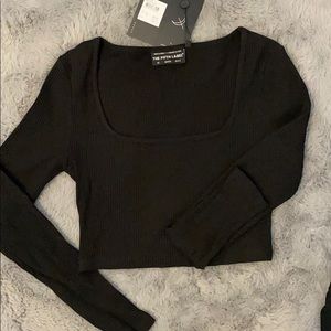 black cropped long sleeve shirt with a “u” neck